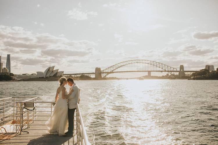 Romantic bridal portrait on a Sydney Harbour Ferry at sunset by Joel Quinn