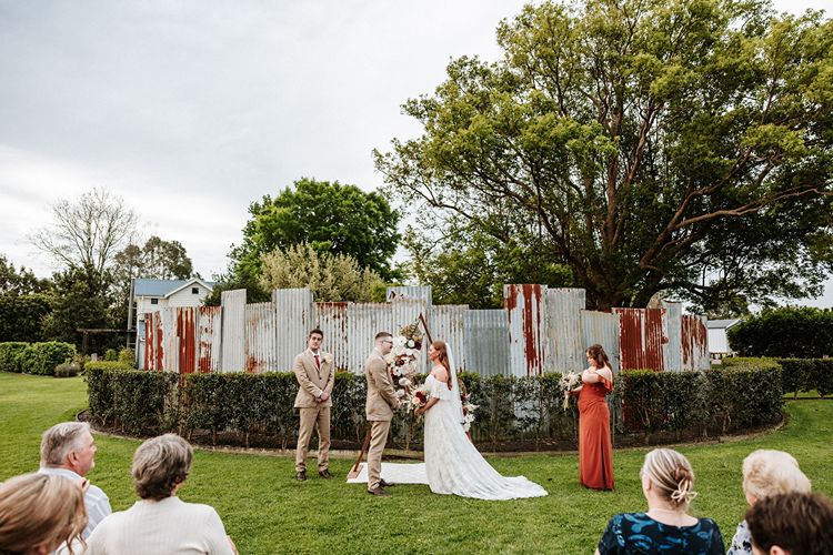 Corrugated iron fence wedding ceremony at Figbird Cottage