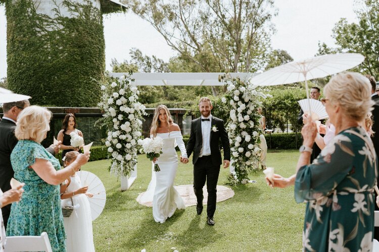 Country gardens wedding venue set against a rustic silo in Berry