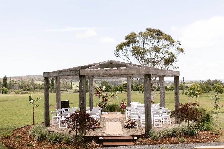 Circular ceremony venue overlooking South Coast farms 