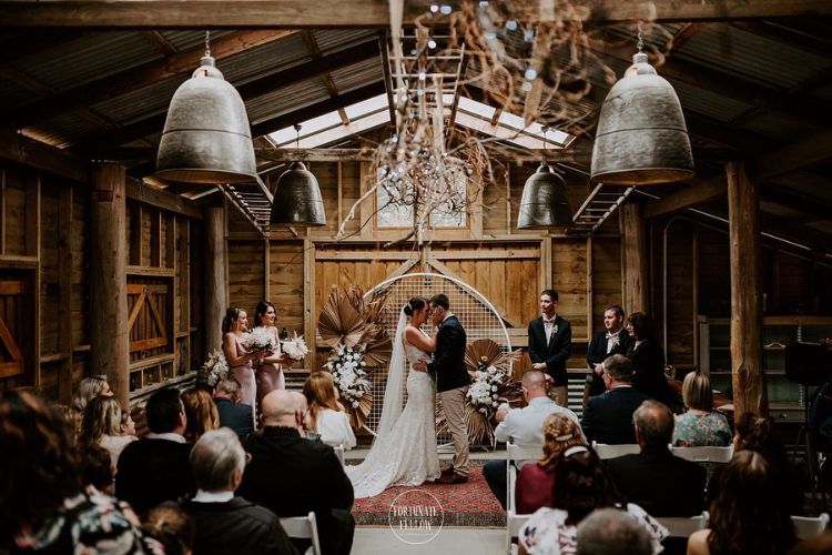 Intimate wedding ceremony in Growwild Wildflower Farm's small barn venue
