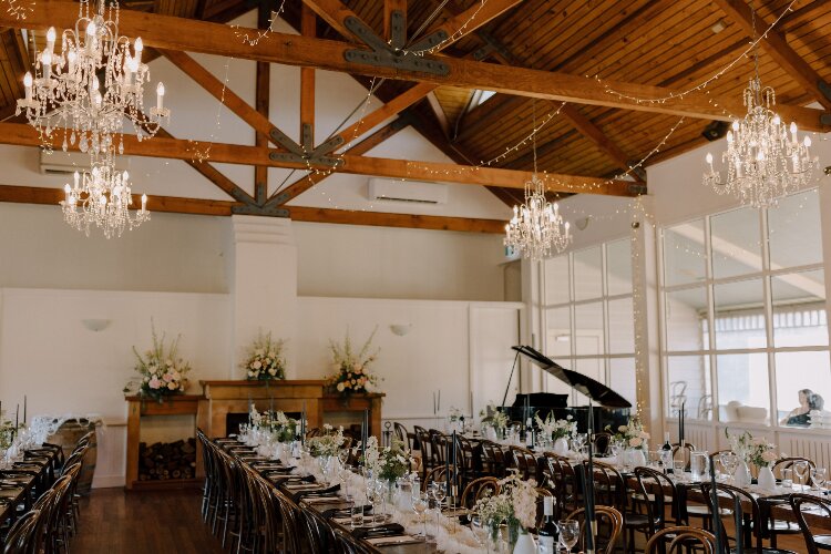 Rustic reception venue with exposed timber trusses at Wandin Valley Estate