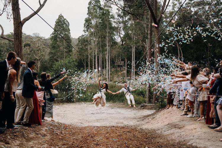 Bride & Groom on zip lines at Kianinny Bush Retreat in Tathra