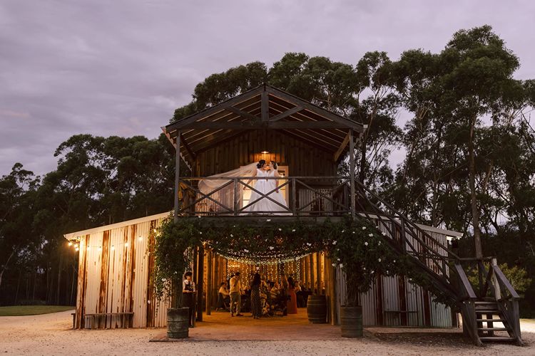 Two brides during rustic wedding reception at The Stables of Somersby