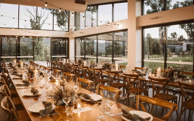 Wedding reception hall with tables set at BYO venue Kangaroo Valley Bush Retreat