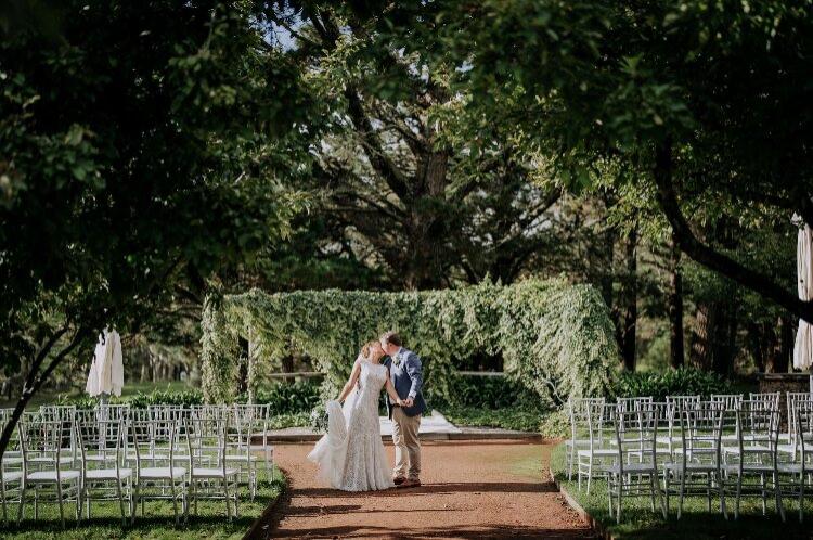 Wedding ceremony arbour in an orchard garden at rural property Sylvan Glen