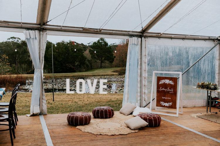 The garden marquee wedding venue overlooks Paradise Botanical Gardens dam