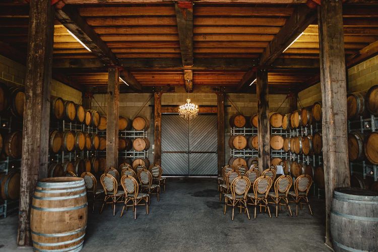 Intimate barn wedding ceremony indoors at Wandin Valley Estate