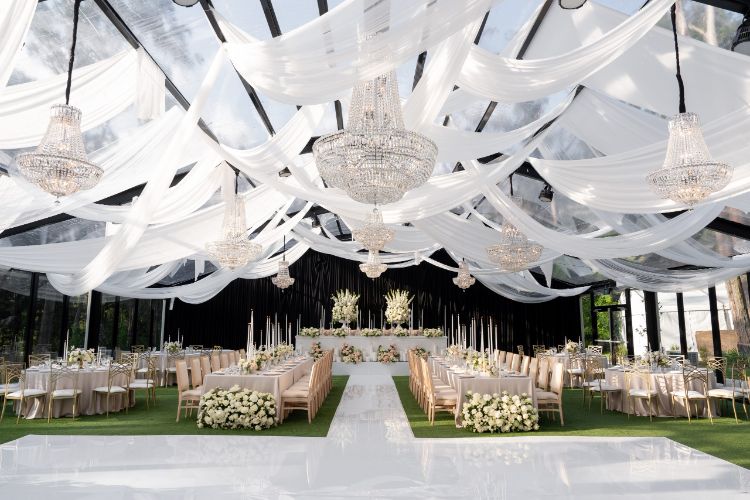 Elegant marquee wedding reception at Springfield House with draped ceiling
